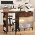 69" Kitchen Island with 360Â° Rotating Table,LED Lighting, Adjustable Shelves, Storage Cabinet & Power Outlet â Walnut Finish Extendable Dining Table for Kitchen, Dining Room, Bar